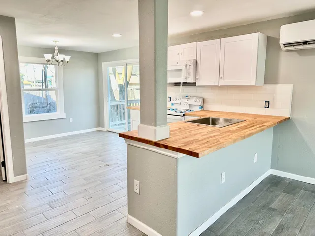 a kitchen with stainless steel appliances granite countertop a sink and cabinets