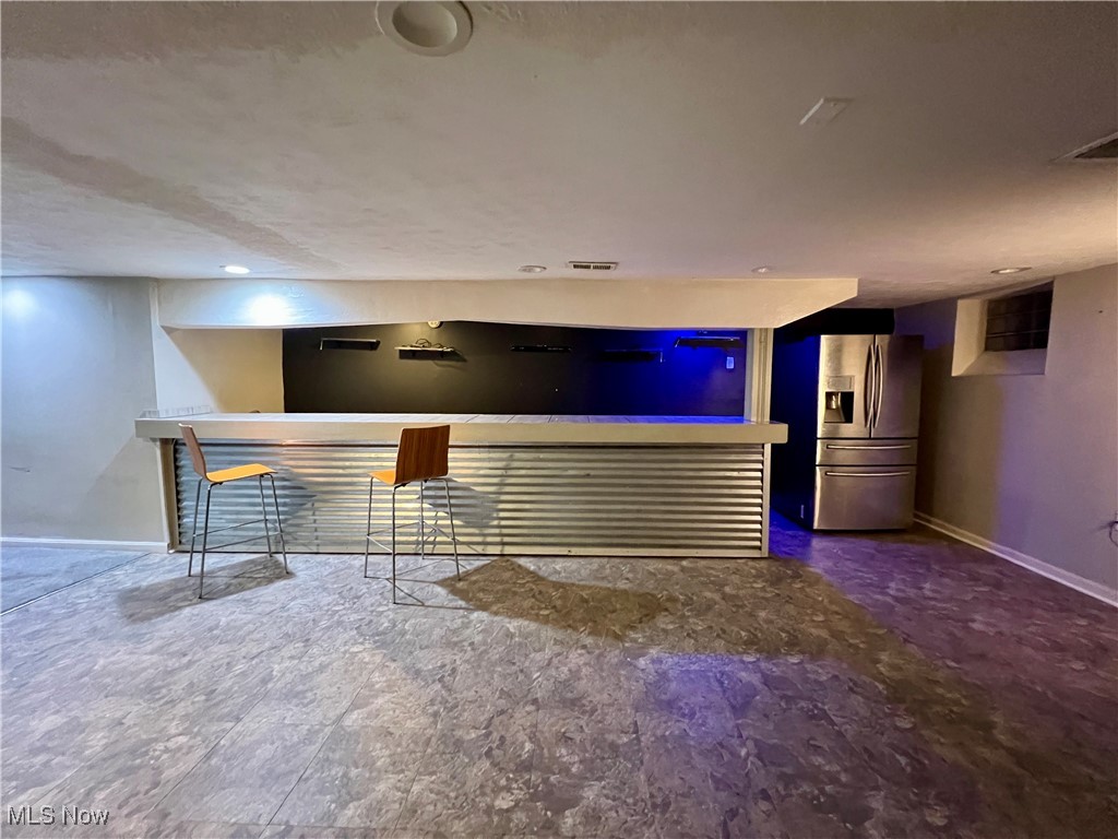 1042 Allston Road Cleveland Heights, OH 44121 - Photo 21 of 22 Bar featuring stainless steel fridge