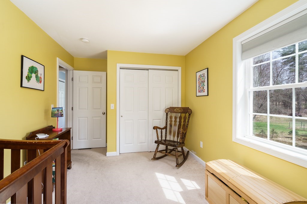 195 Brickyard Road Southampton, MA 01073 - Photo 24 of 42 a view of a workspace with furniture and a window