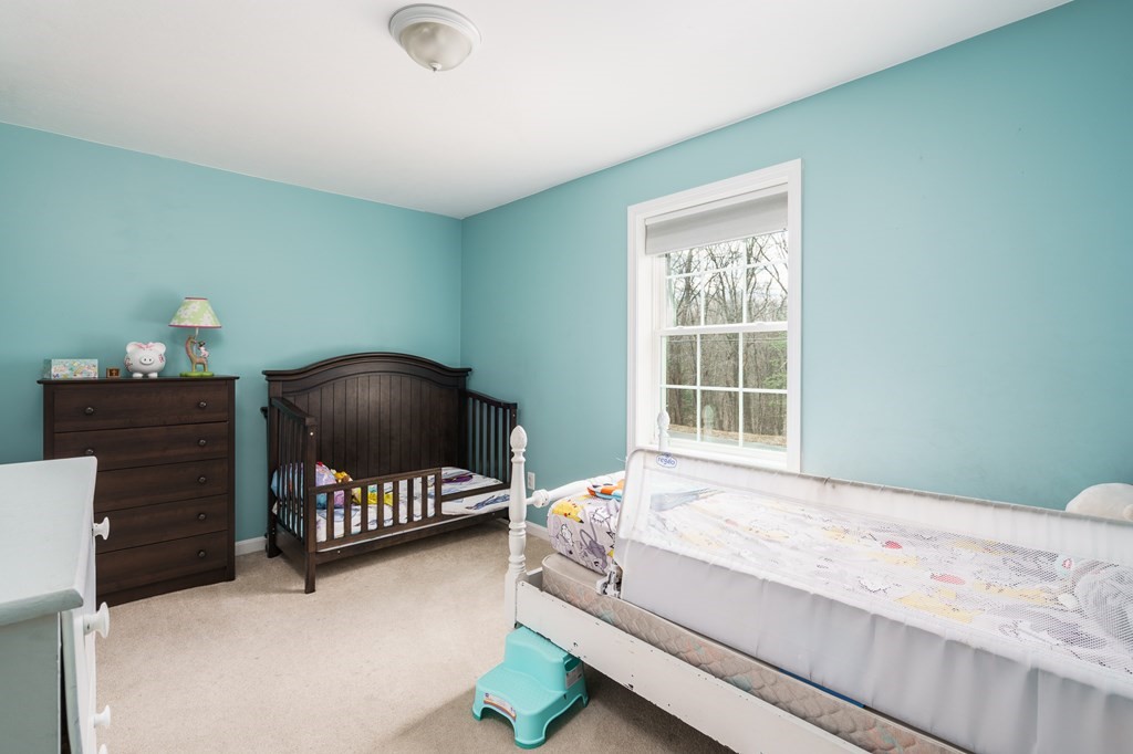 195 Brickyard Road Southampton, MA 01073 - Photo 25 of 42 a bedroom with a bed and window