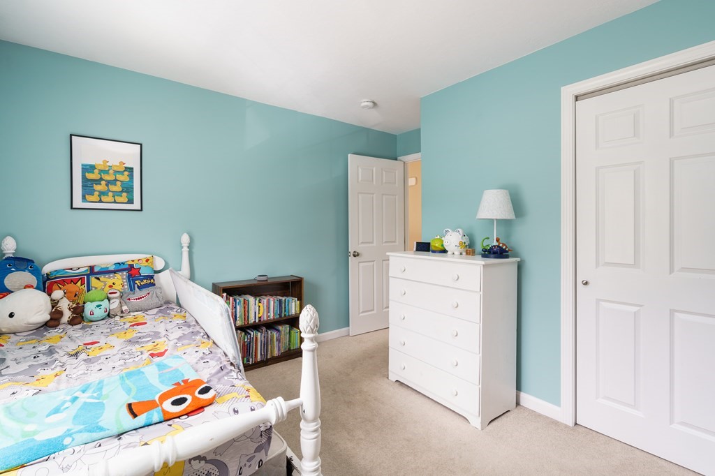 195 Brickyard Road Southampton, MA 01073 - Photo 26 of 42 a bedroom with a bed and wooden floor