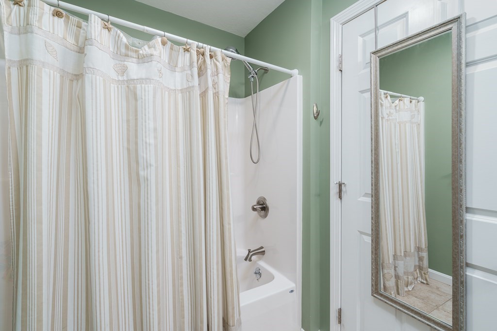 195 Brickyard Road Southampton, MA 01073 - Photo 31 of 42 a bathroom with a shower curtain and a curtain