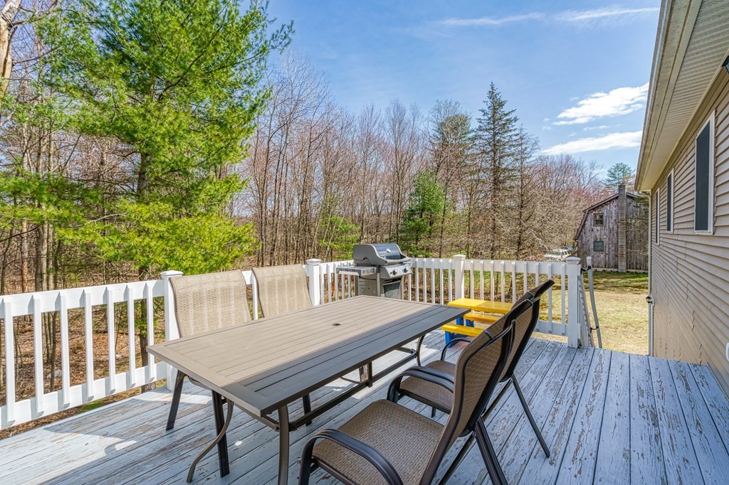 195 Brickyard Road Southampton, MA 01073 - Photo 36 of 42 a view of a balcony with furniture and wooden floor