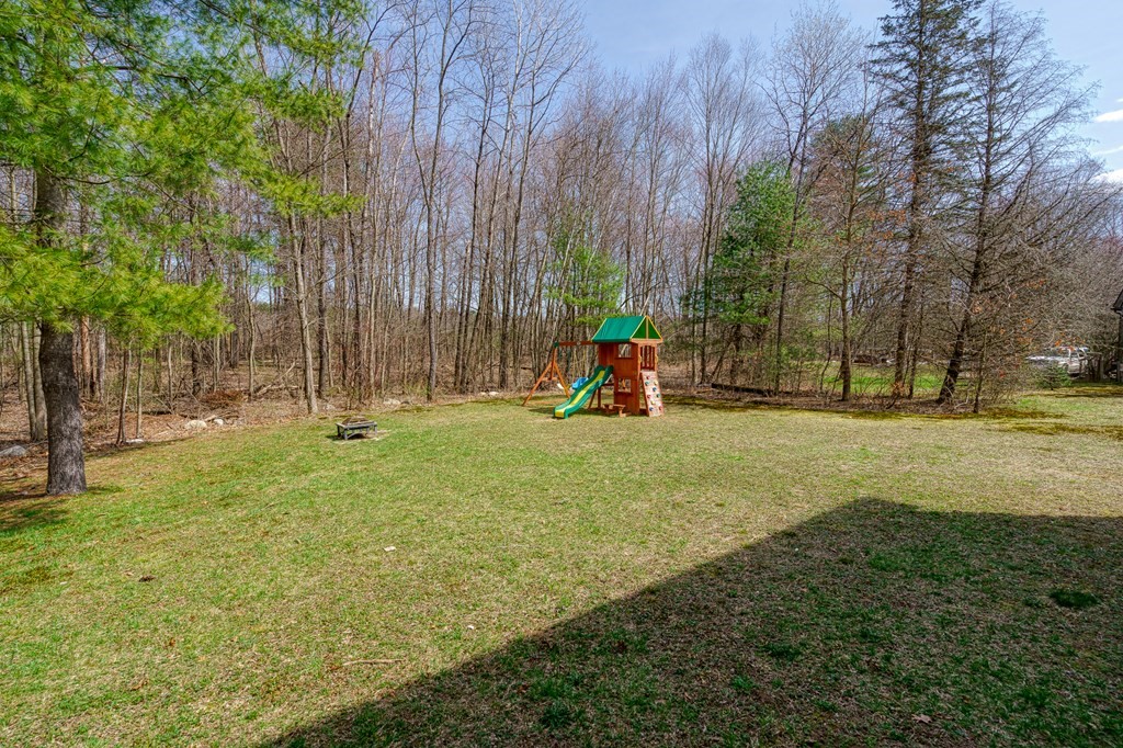195 Brickyard Road Southampton, MA 01073 - Photo 37 of 42 a view of a park with swings and slides