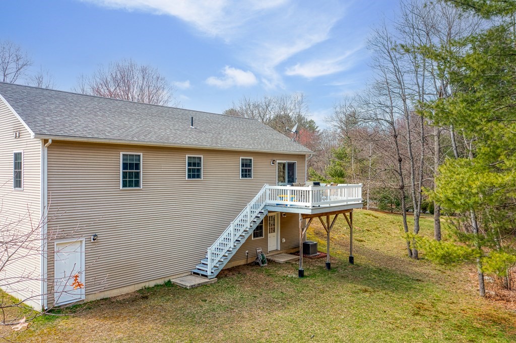 195 Brickyard Road Southampton, MA 01073 - Photo 38 of 42 a view of a house with backyard and a tree