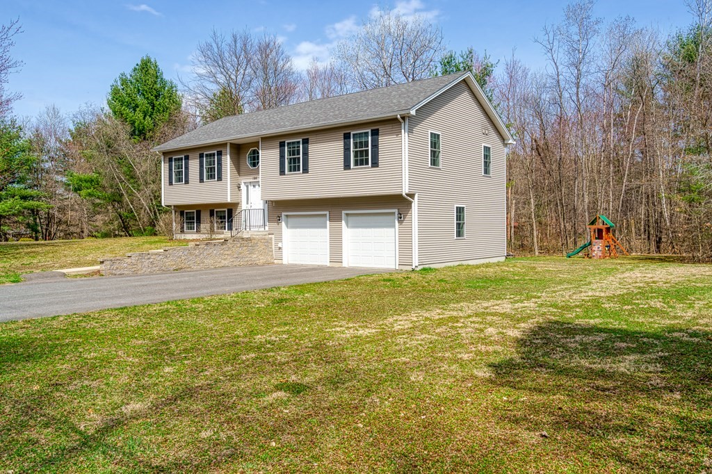 195 Brickyard Road Southampton, MA 01073 - Photo 5 of 42 a front view of a house with a yard