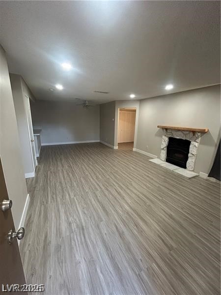 9070 Spring Mountain Road, Unit 210 Las Vegas, NV 89117 - Photo 2 of 12 This expansive living area features durable flooring and a beautiful fireplace, ideal for relaxing evenings.