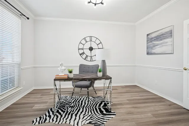 a living room with furniture a table and wooden floor