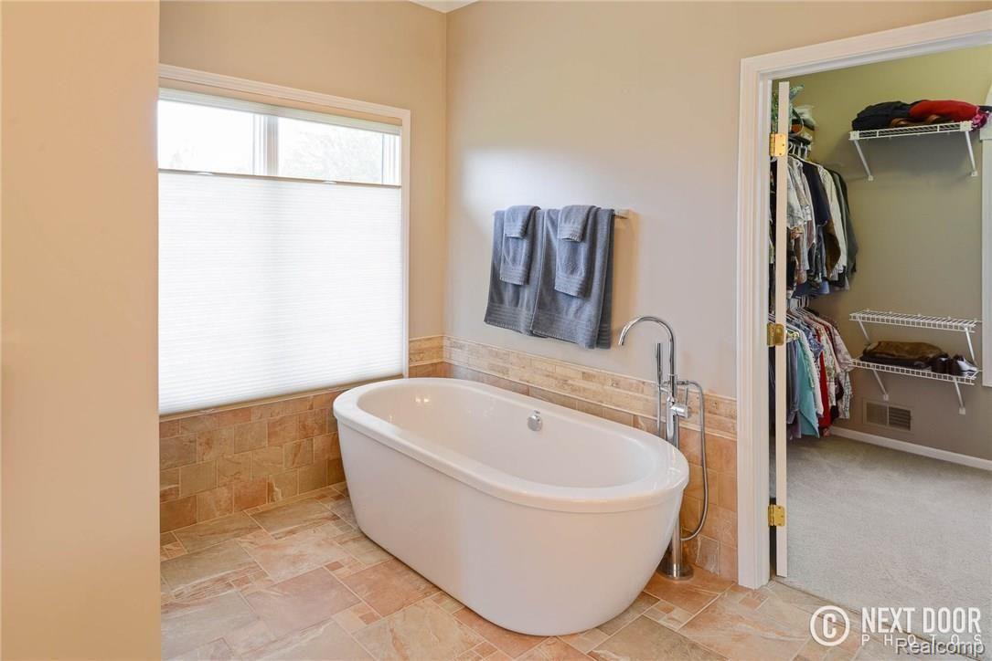4886 Pleasant Valley Road Brighton, MI 48114 - Photo 24 of 51 Soak away at the end of the day!