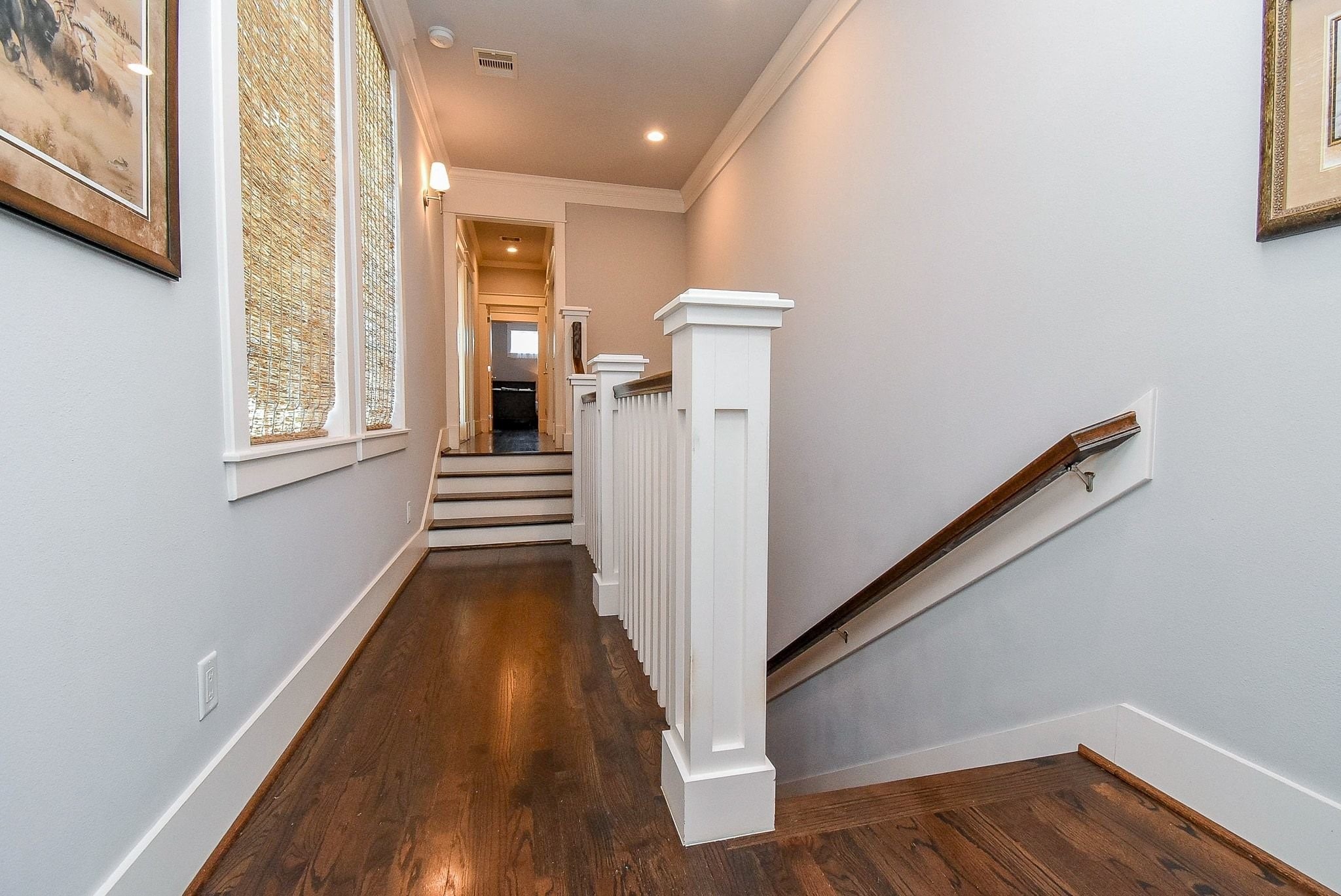 1036 Kern Street Houston, TX 77009 - Photo 24 of 47 Your view from the landing at the top of the stairs. Behind is the Primary Suite, while ahead are two (2) secondary bedrooms with a connecting full bath, along with 2 storage closets and the laundry area.