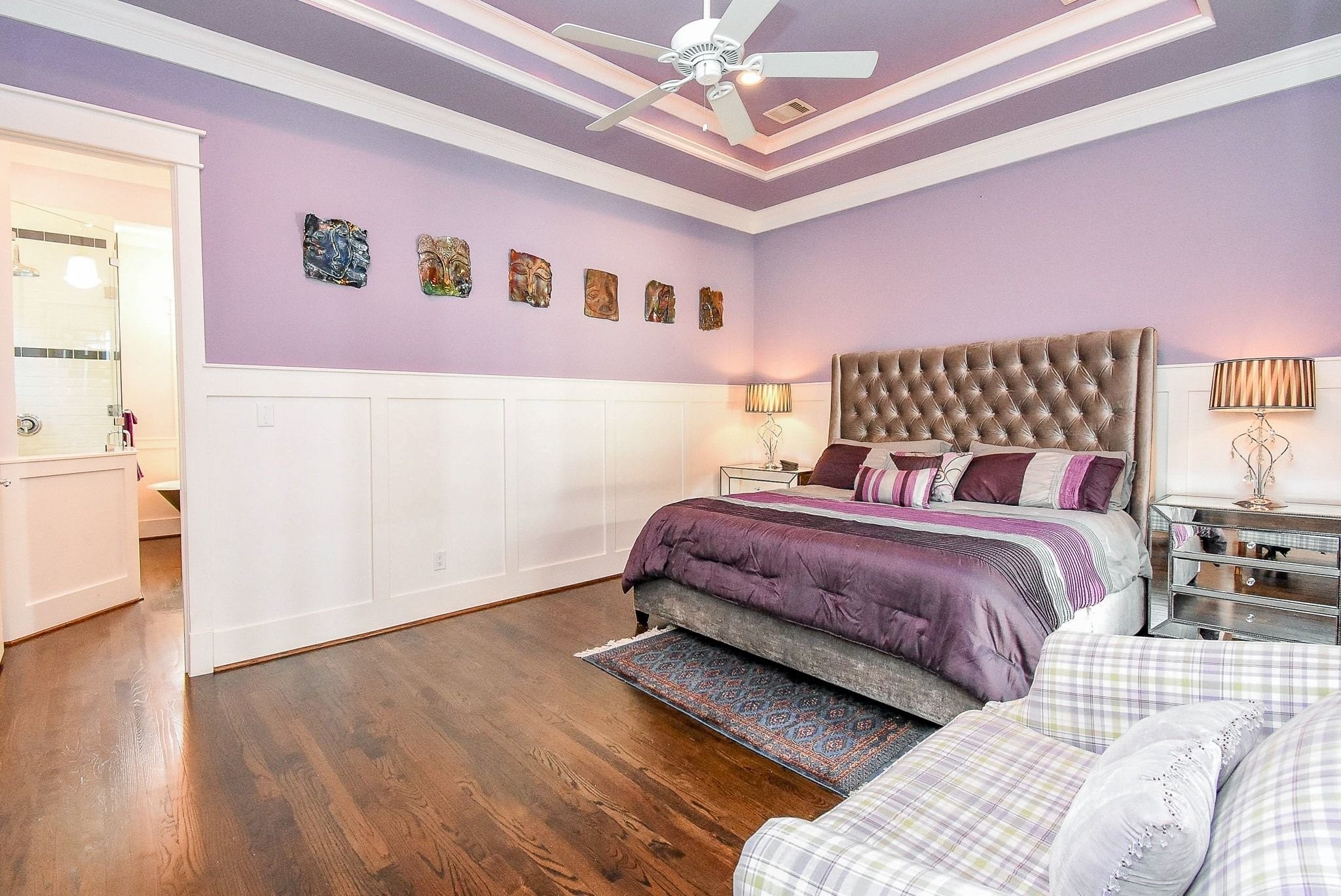 1036 Kern Street Houston, TX 77009 - Photo 25 of 47 Check out this enormous Primary Suite with tiered ceiling and more intricate millwork! There is even rope lighting on the top layer closest to the ceiling. The wood floors sparkle.