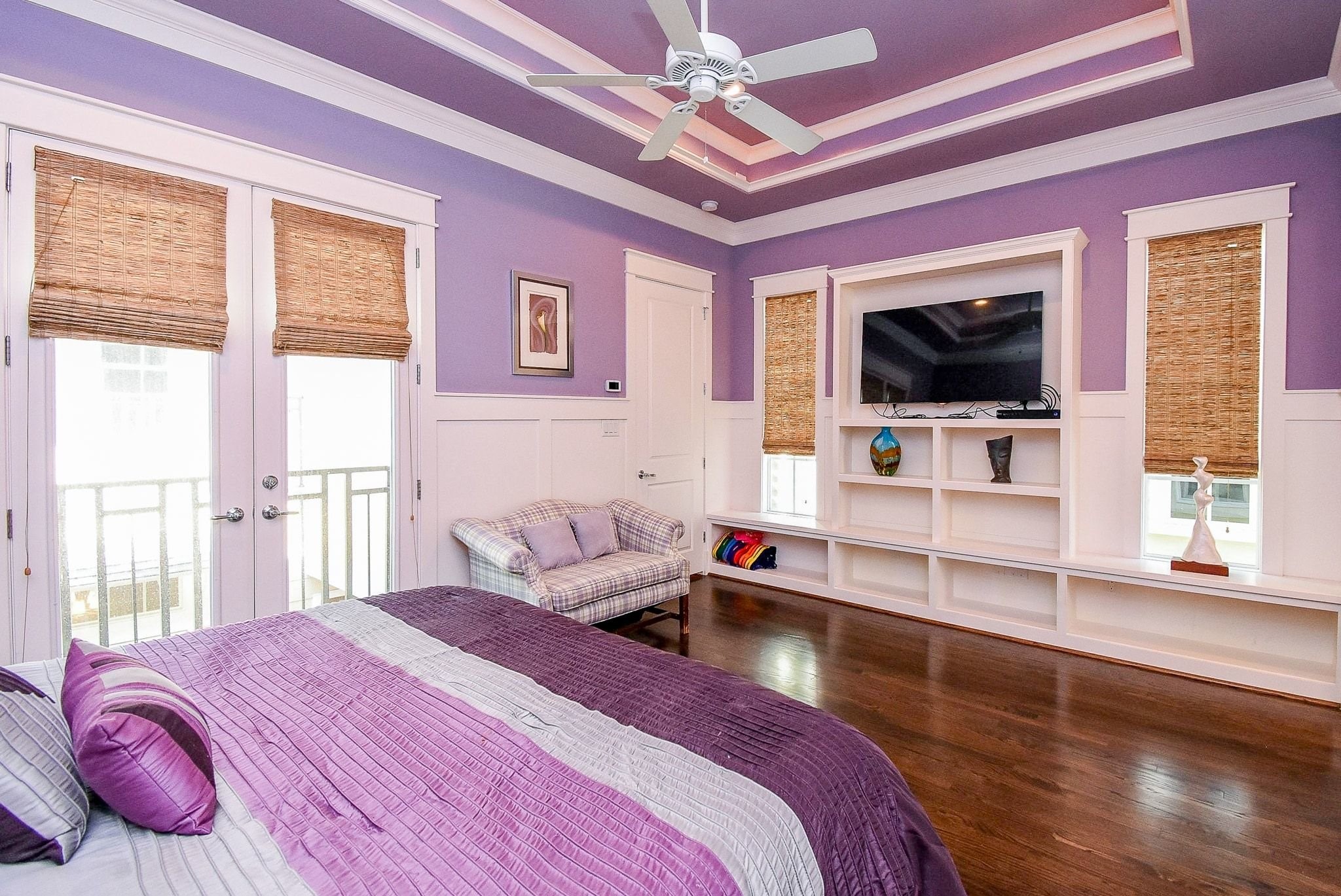 1036 Kern Street Houston, TX 77009 - Photo 27 of 47 Another vantage point of the Primary Suite looking opposite the bed. Again, notice the beautiful built-in open shelving that is so great for displaying your family photos or art or book collection. The custom wood woven shades provide privacy and help create perfect conditions for sleeping late on the weekends!