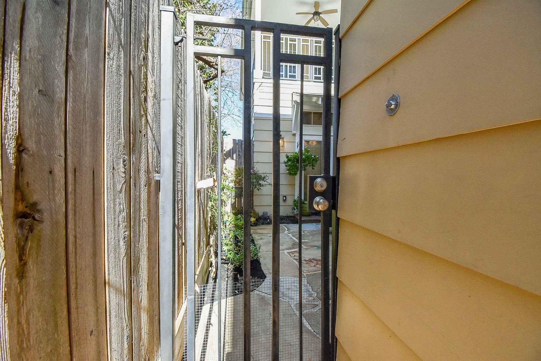 1036 Kern Street Houston, TX 77009 - Photo 3 of 47 A wrought-iron, lockable gate (with doorbell that rings inside the house) provides you with added security and peace of mind.
