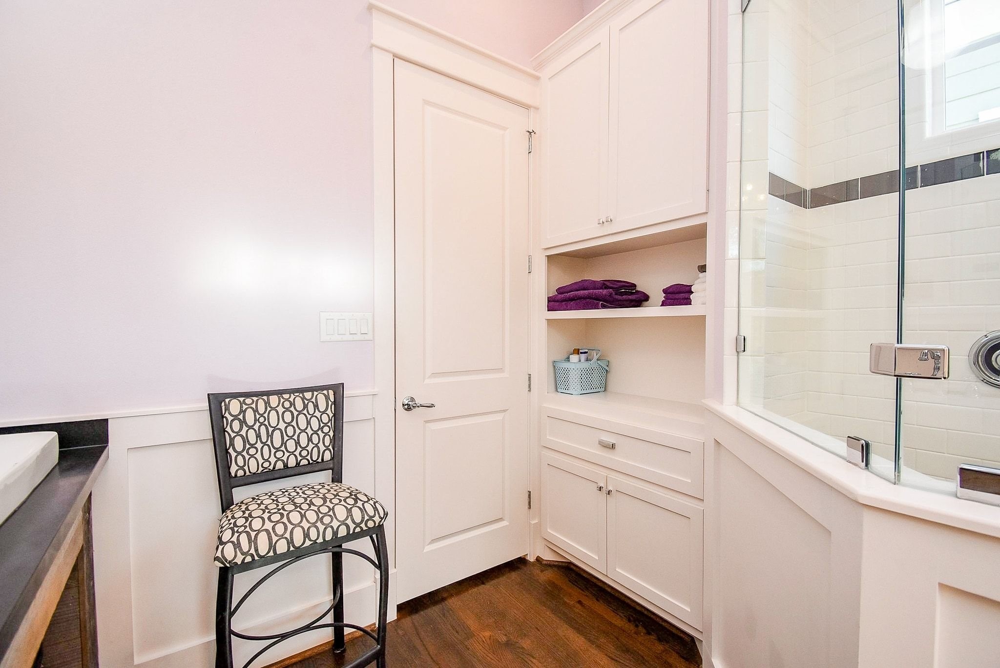 1036 Kern Street Houston, TX 77009 - Photo 33 of 47 From near the shower looking back towards the door to the Primary Bathroom. Note the additional storage & display space, including a laundry hamper.