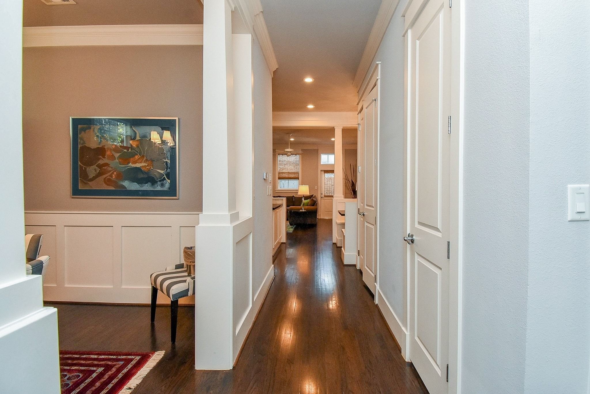 1036 Kern Street Houston, TX 77009 - Photo 8 of 47 Gleaming REAL hardwoods throughout the home (no carpet anywhere). This is your view upon entering the home. To the left is the formal Dining Room, and to the right is a conveniently located, private half-bathroom. Up ahead are the Kitchen & main Living Area.