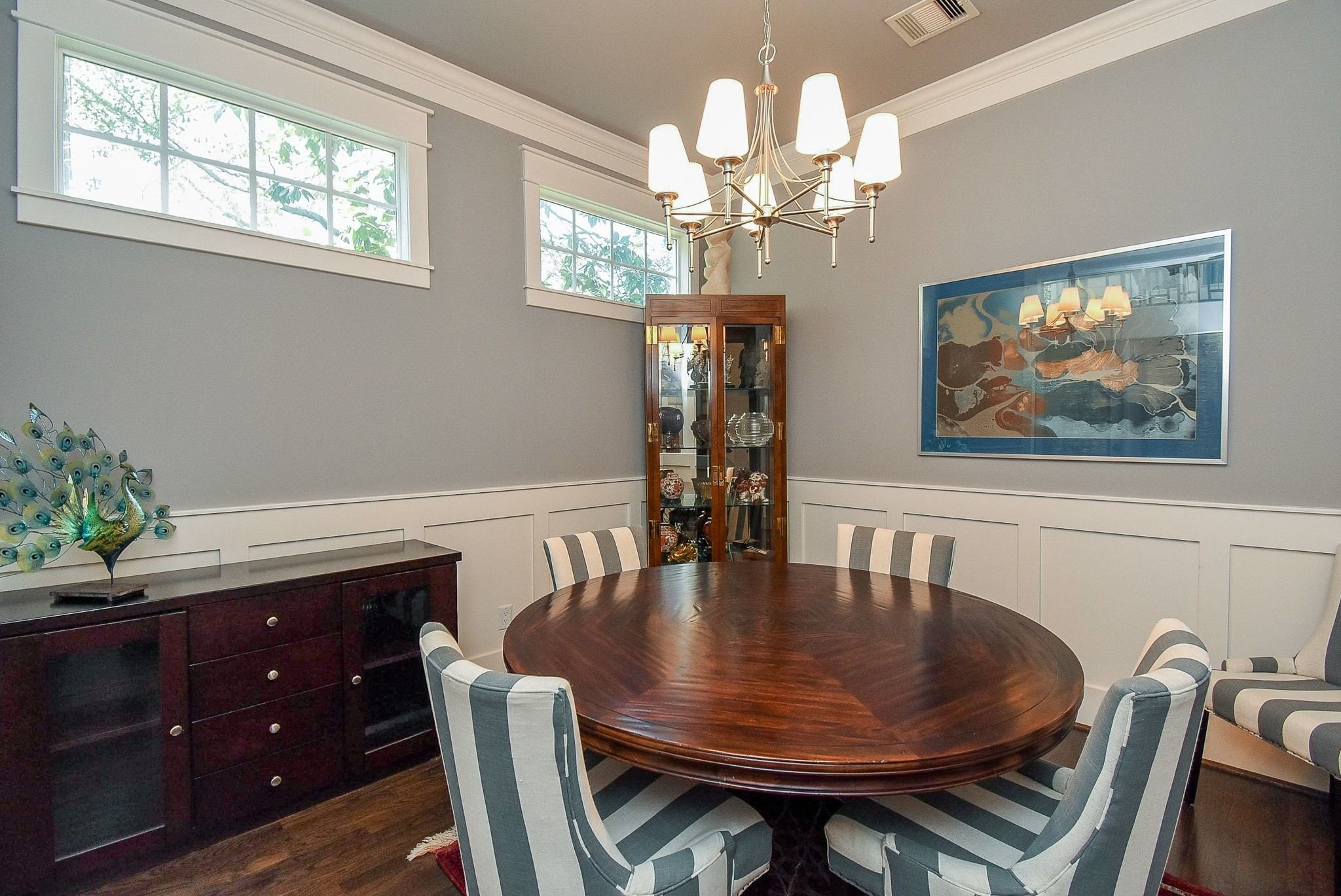 1036 Kern Street Houston, TX 77009 - Photo 10 of 47 An alternate look at the Dining Room. Note the beautiful chandelier, and neutral paint. Again, let your eyes marvel at the detailed craftsmanship of the mouldings/trim pieces/millwork.