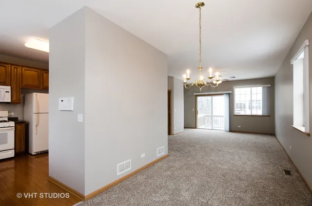 a view of a windows and chandelier in a room