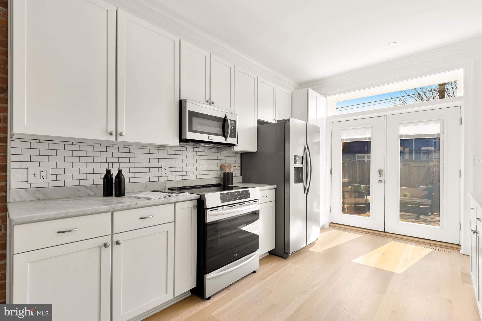 316 Elm Street Northwest Washington, DC 20001 - Photo 12 of 43 a kitchen with appliances a sink and cabinets