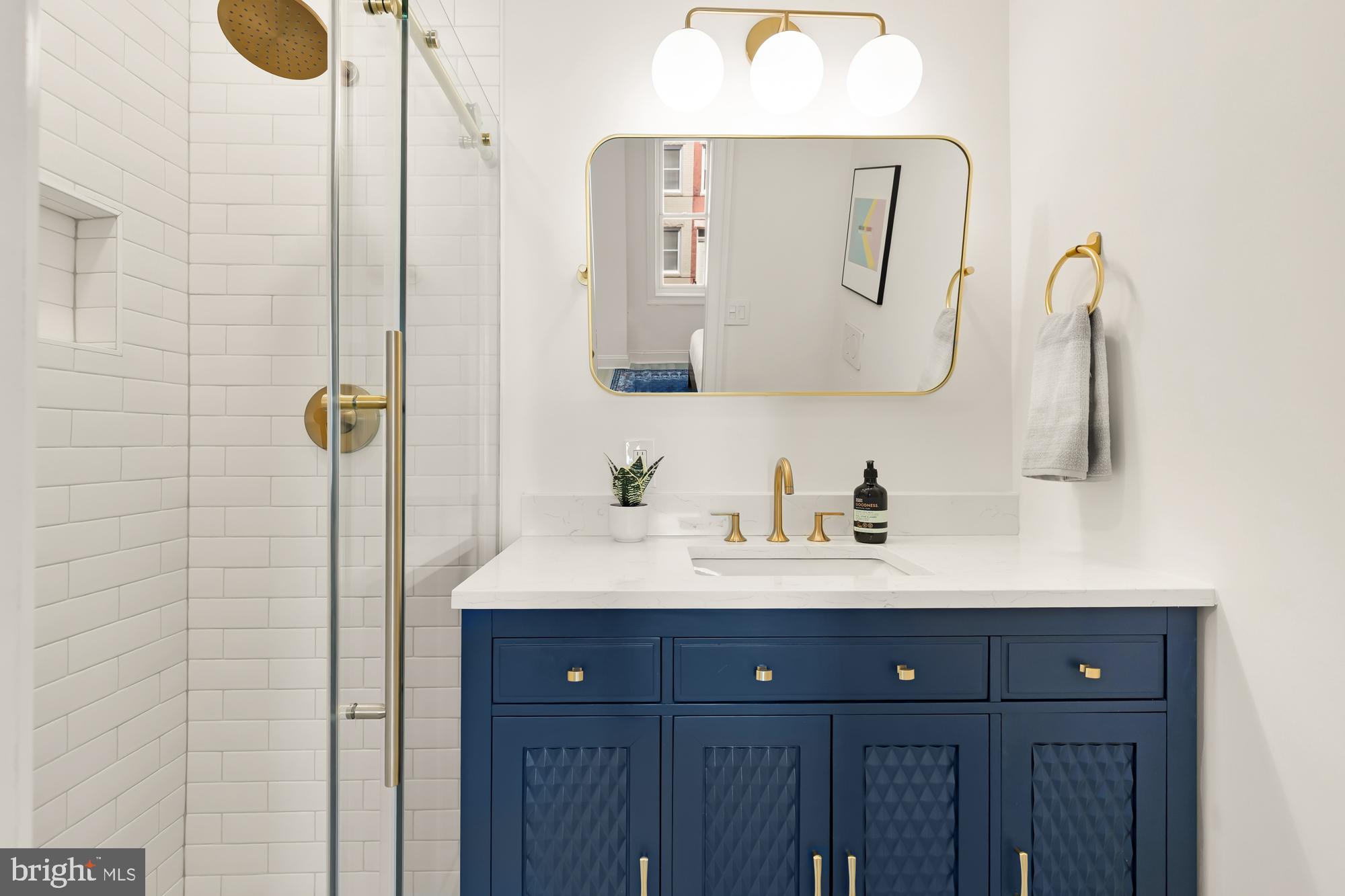 316 Elm Street Northwest Washington, DC 20001 - Photo 24 of 43 a bathroom with a sink vanity and a mirror