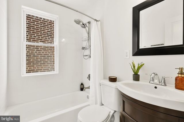 a view of a room with furniture and windows