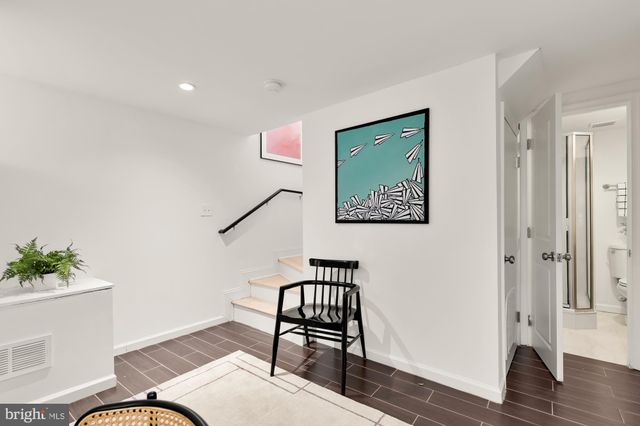 a view of workspace with furniture and wooden floor