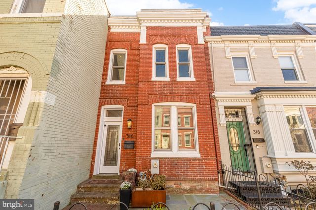 a front view of a building with a glass windows
