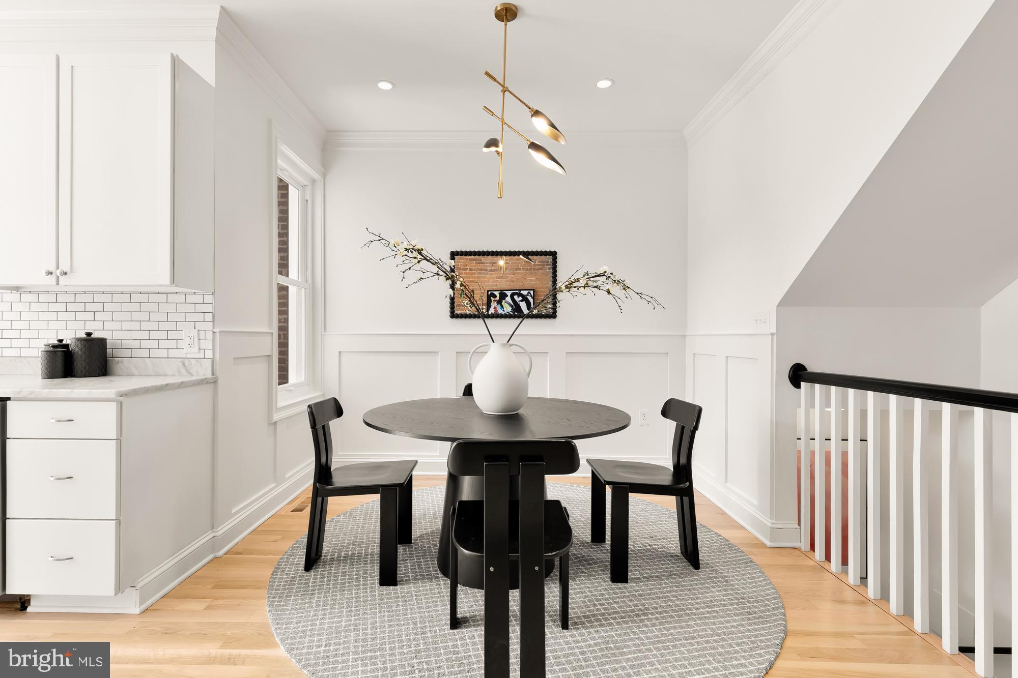 316 Elm Street Northwest Washington, DC 20001 - Photo 8 of 43 a view of a dining room with furniture and wooden floor
