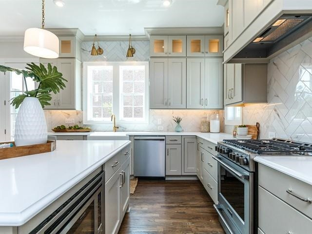 1017 Whitehall Circle Durham, NC 27713 - Photo 11 of 25 a kitchen with stainless steel appliances granite countertop a sink a stove and a wooden cabinets