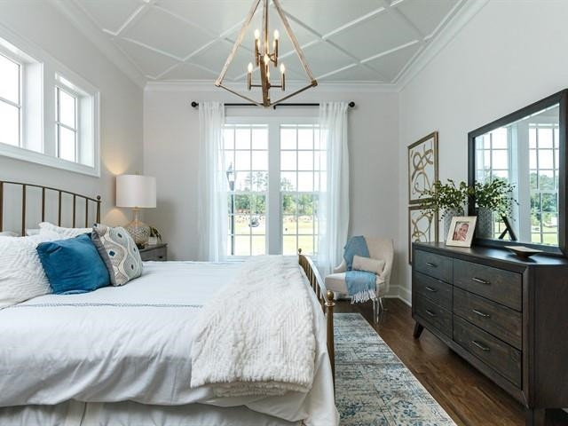 1017 Whitehall Circle Durham, NC 27713 - Photo 17 of 25 a bed room with a bed and a large window