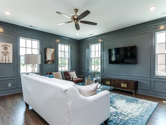 1017 Whitehall Circle Durham, NC 27713 - Photo 21 of 25 a living room with furniture and a flat screen tv