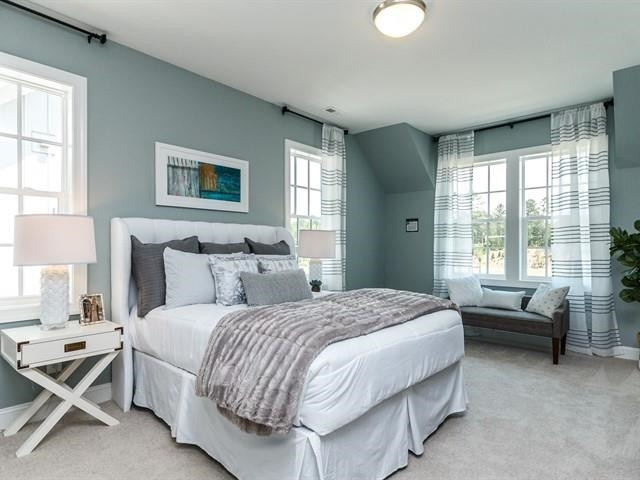 1017 Whitehall Circle Durham, NC 27713 - Photo 22 of 25 a bedroom with a bed and a couch