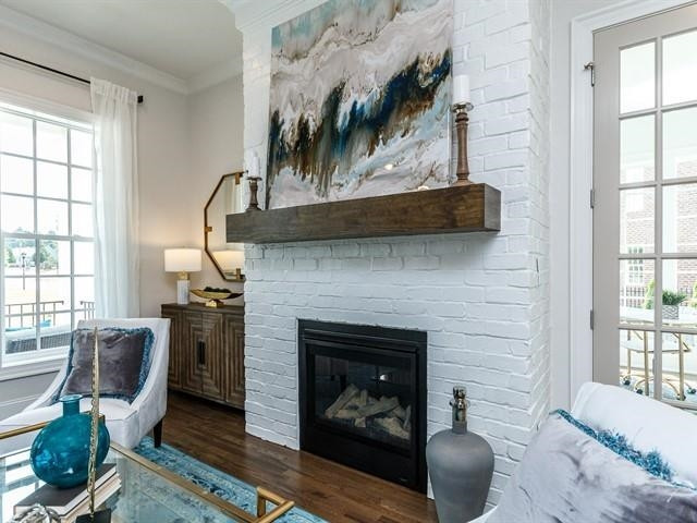 1017 Whitehall Circle Durham, NC 27713 - Photo 6 of 25 a living room with furniture and a fireplace