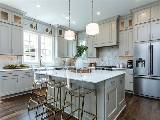 1017 Whitehall Circle Durham, NC 27713 - Photo 10 of 25 a kitchen with cabinets a sink stainless steel appliances and window