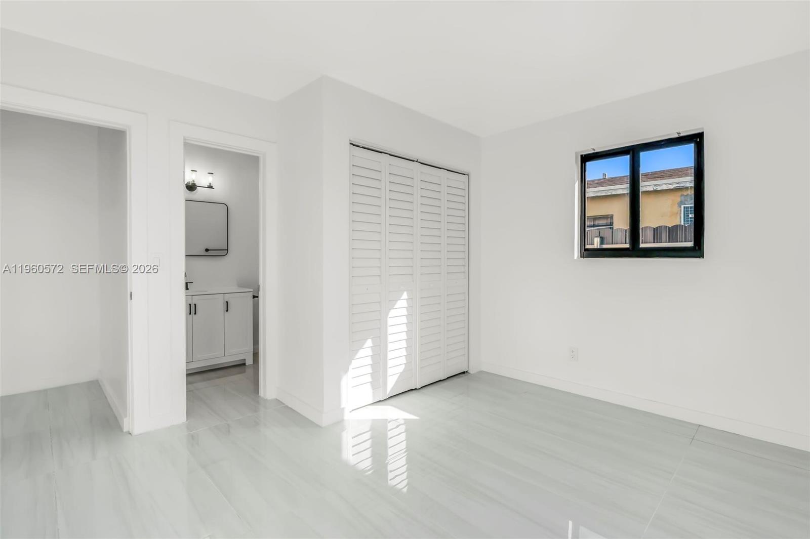 528 Northwest 3rd Court Hallandale Beach, FL 33009 - Photo 14 of 25 an empty room with a bathroom and a sink