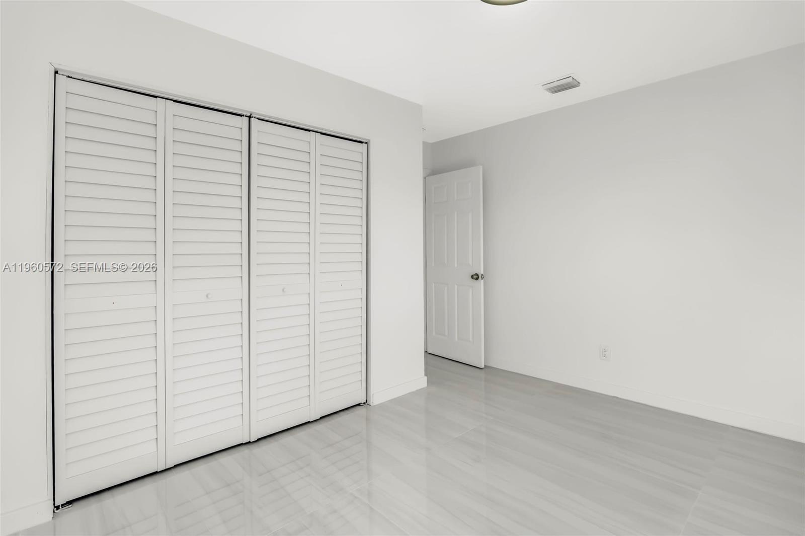 528 Northwest 3rd Court Hallandale Beach, FL 33009 - Photo 17 of 25 an empty room with closet