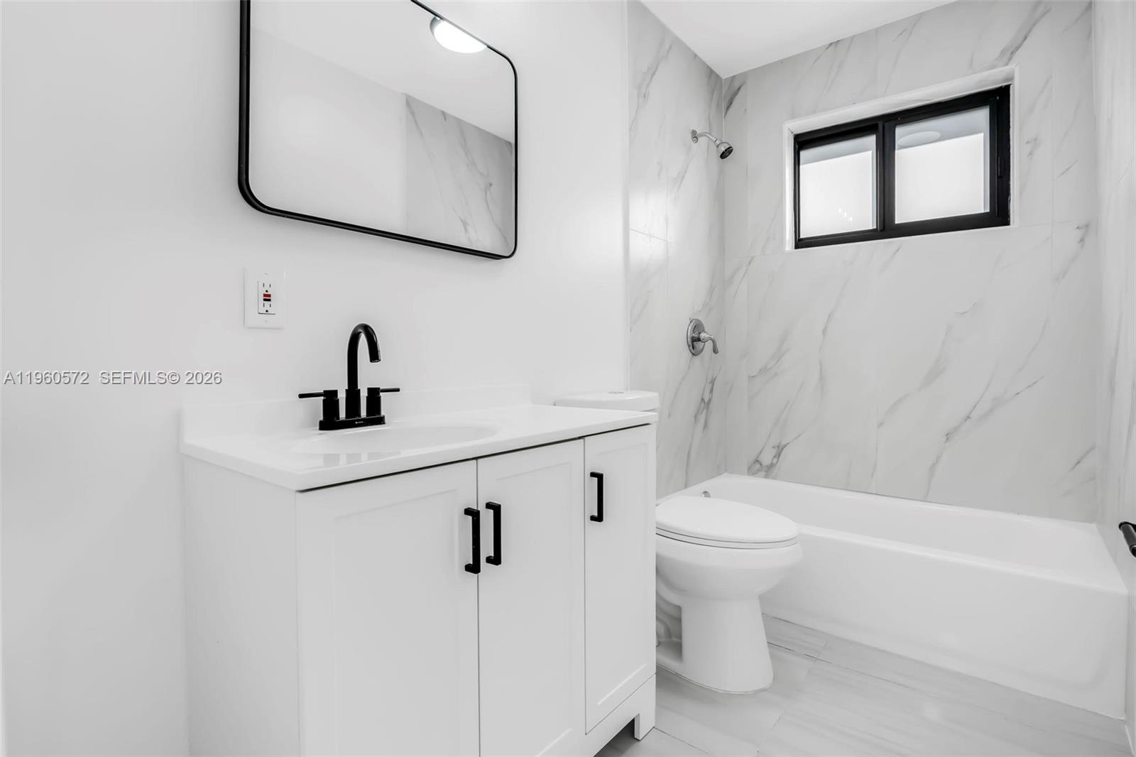 528 Northwest 3rd Court Hallandale Beach, FL 33009 - Photo 20 of 25 a bathroom with a toilet sink and a bathtub