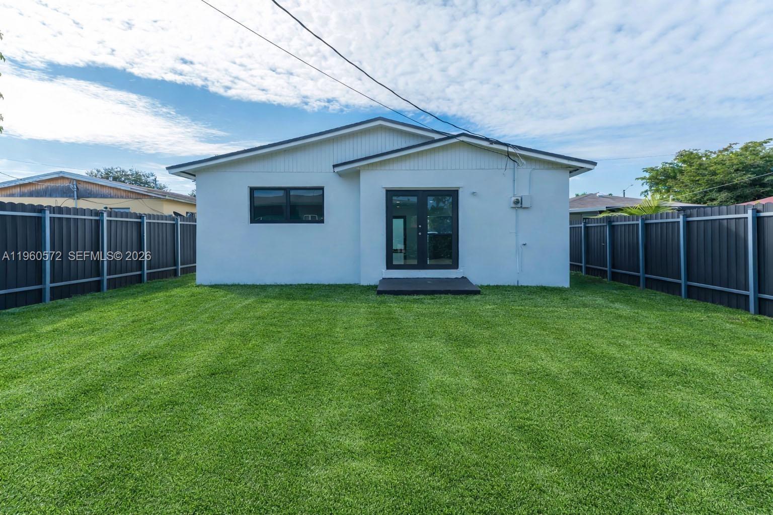 528 Northwest 3rd Court Hallandale Beach, FL 33009 - Photo 24 of 25 a view of a house with backyard and garden