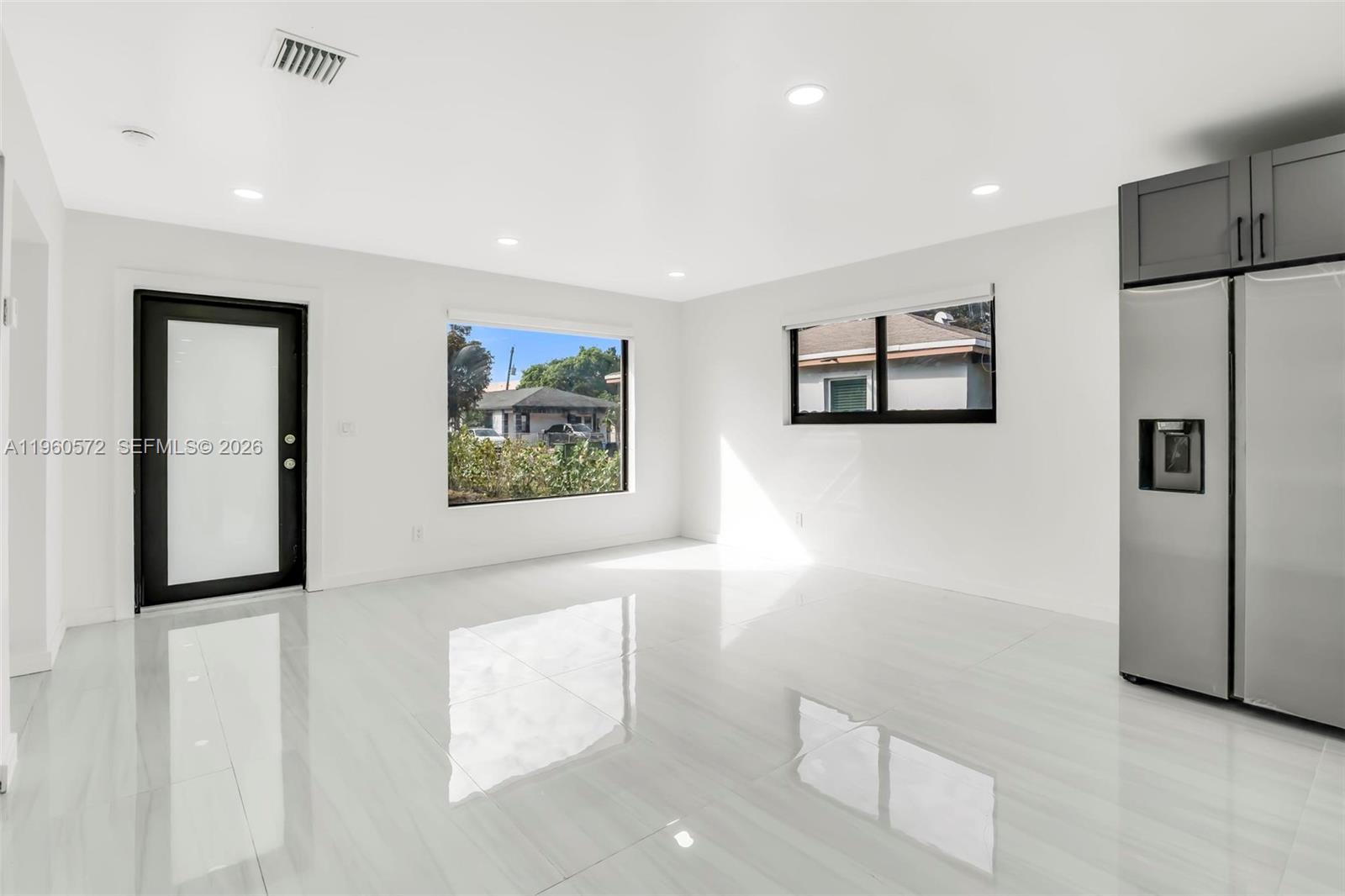 528 Northwest 3rd Court Hallandale Beach, FL 33009 - Photo 3 of 25 a view of a hallway with a elevator