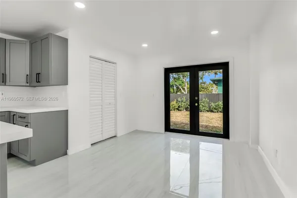 a view of an empty room with a window