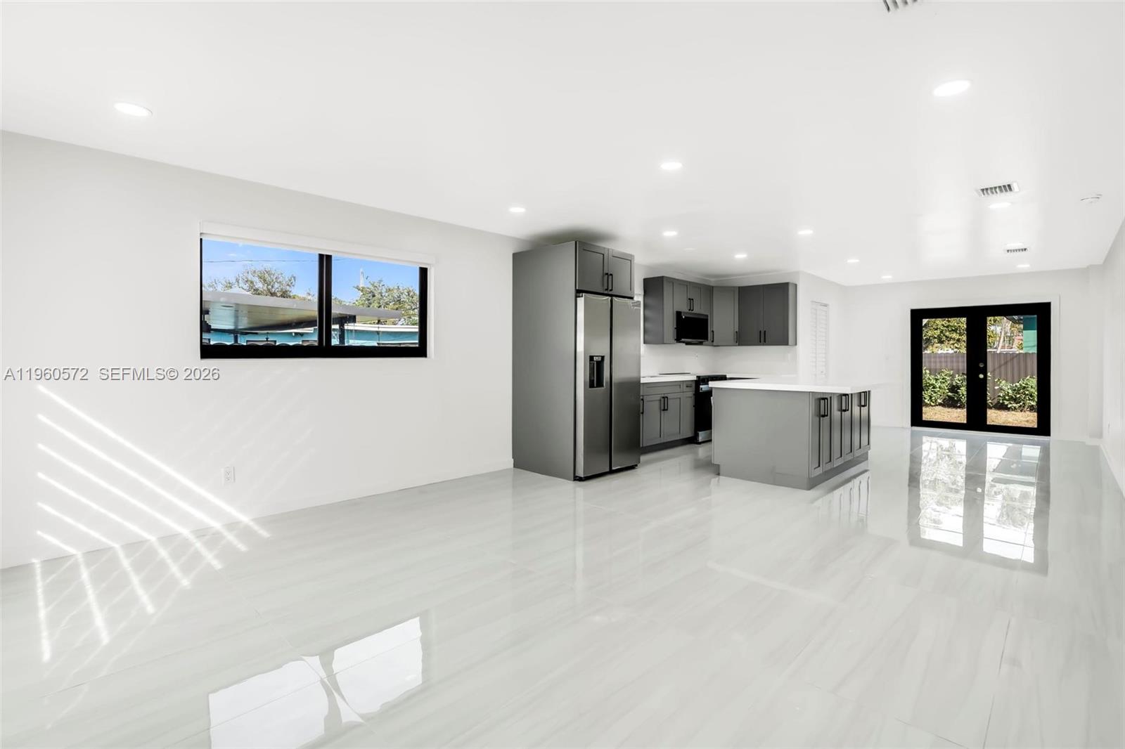 528 Northwest 3rd Court Hallandale Beach, FL 33009 - Photo 10 of 25 a view of kitchen with stainless steel appliances cabinets