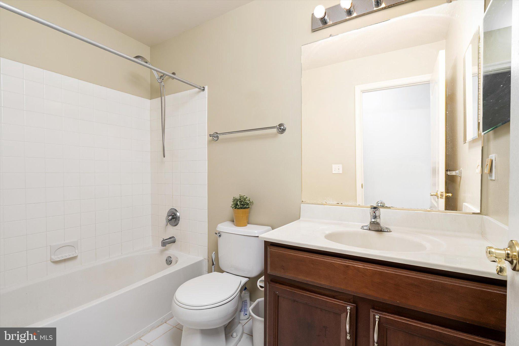 24 Blake Drive Pennington, NJ 08534 - Photo 26 of 28 a bathroom with a sink a toilet and a mirror