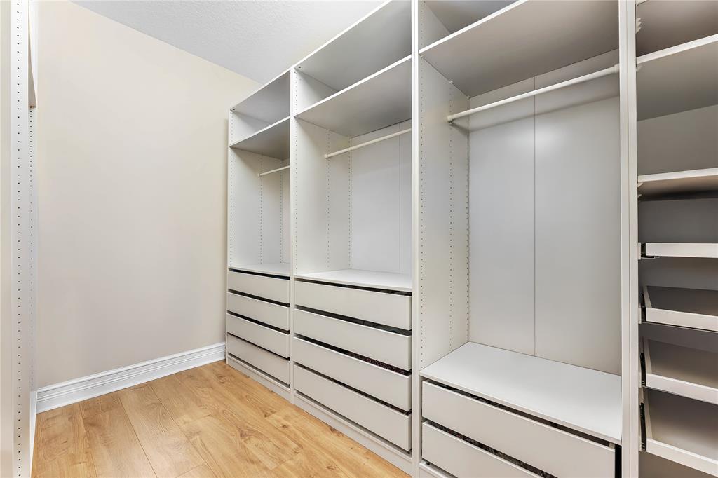 9571 Eden Roc Court Delray Beach, FL 33446 - Photo 23 of 45 a view of an empty walk in closet
