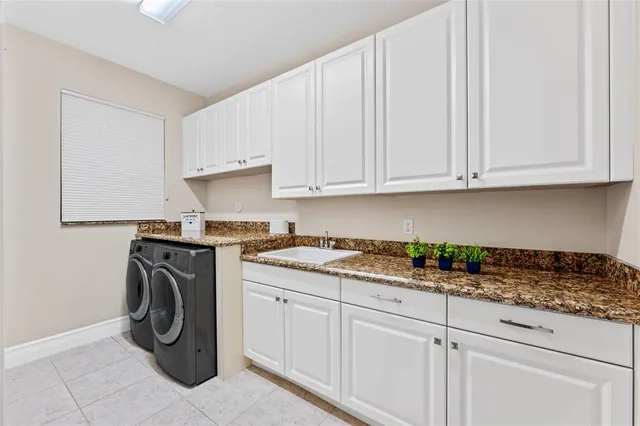 a bathroom with a sink shower and a mirror