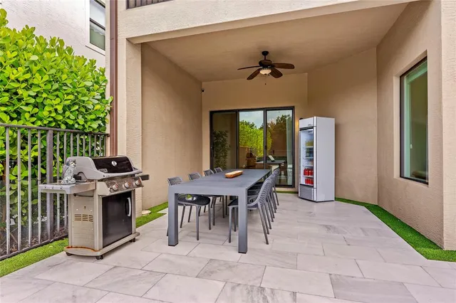 a front view of a house with a yard table and chairs