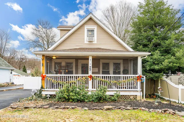 a front view of a house with a porch