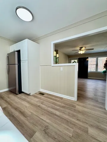 a view of a livingroom with wooden floor
