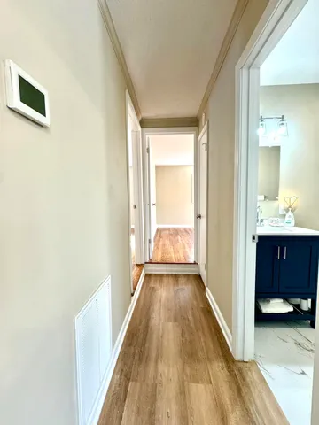 a bathroom with a double vanity sink toilet and a mirror