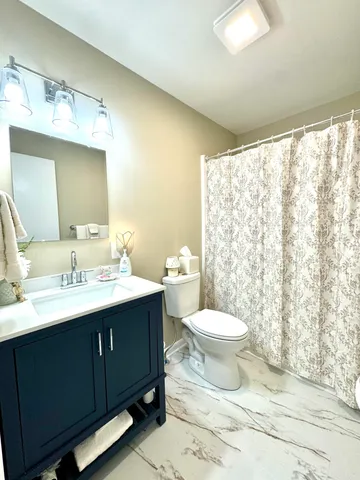 a white bath tub and a shower