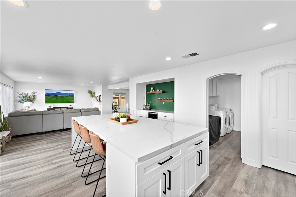 4314 Silver Spring Way Oceanside, CA 92057 - Photo 14 of 49 a kitchen with sink cabinets and wooden floor