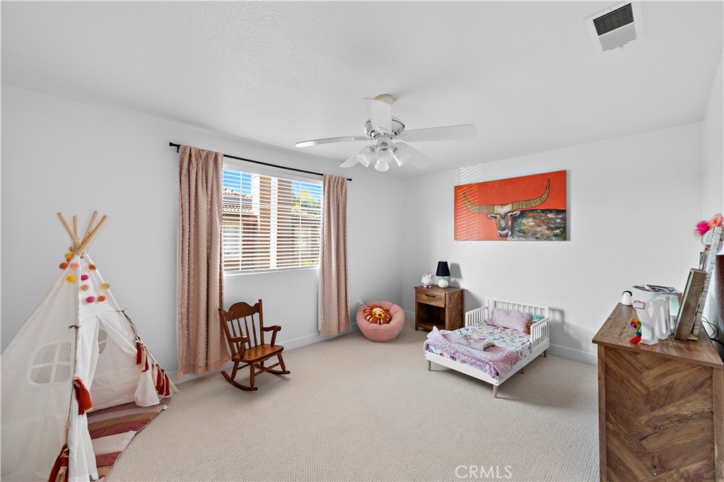 4314 Silver Spring Way Oceanside, CA 92057 - Photo 25 of 49 a living room with furniture and a chandelier